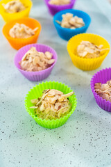 Lemon poppy seed muffins garnished with almond slivers