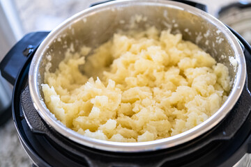 Whipping Up Creamy Mashed Potatoes in Modern Kitchen