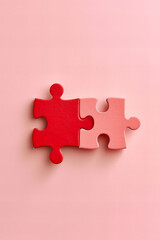 
two puzzle pieces connected together. creative valentines day concept