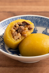 Sweet potato yam bun with ground pork meat, mushroom and chopped bamboo shoot fillings inside.