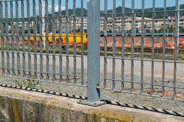 fence, detail of fence with electro-welded stainless steel wire mesh. the grill is made with a...