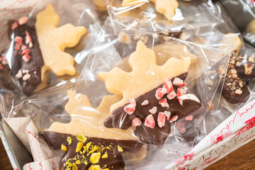 Festive Christmas Tin Boxes Filled with Chocolate-Dipped Treats