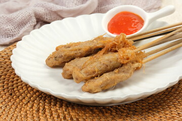 Sempol Ayam, Indonesian Street Food, Made of Chicken, Spices and Egg. Served With Chili Sauce