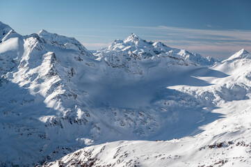 Fototapeta na wymiar Snow covered mountains, Elbrus ski resort. The part of caucasisan mountains range.