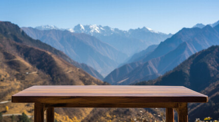 Wooden table mountains bokeh background, empty wood desk surface product display mockup with blurry nature hills landscape abstract travel backdrop advertising presentation. Mock up, copy space.