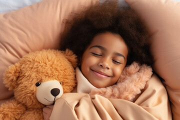 Top view of cute little preschooler African American girl lying cuddling with favorite fluffy toy waking up in cozy home bed