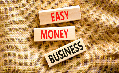 Easy money business symbol. Concept words Easy money business on beautiful wooden blocks. Beautiful canvas table canvas background. Easy money business concept. Copy space.