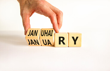 Januhairy or January symbol. Concept words Januhairy or January on beautiful wooden blocks. Beautiful white table white background. Man hand. Social issues Januhairy or January concept. Copy space.