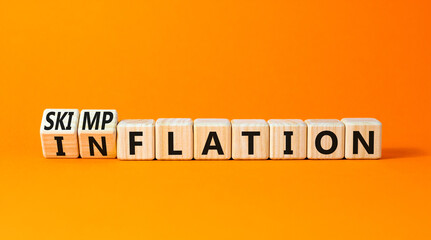Inflation or skimpflation symbol. Concept words Inflation Skimpflation on beautiful wooden blocks....