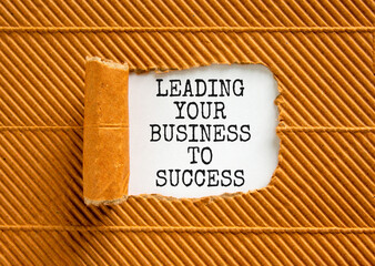 Leading your business to success symbol. Concept words Leading your business to success on beautiful white paper. Beautiful brown paper background. Leading your business to success concept. Copy space