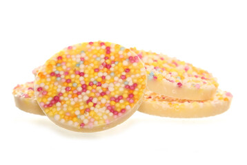 White chocolate jazzie hundreds and thousands sweets isolated on a white background