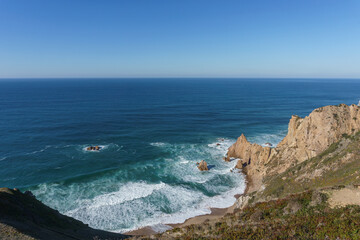 Rock formation at atlantic ocean coast on westernmost point, Cape Roca, Cabo da Roca, Portugal.