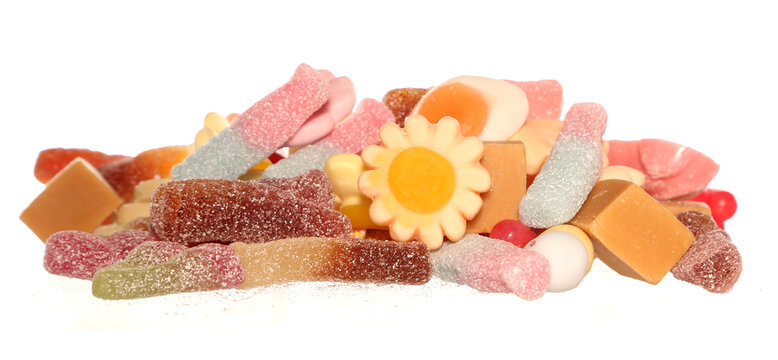 Pile of random pick and mix sweets isolated on a white background