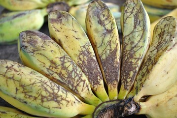Ripe bananas on a wooden background. Close-up. Selective focus.