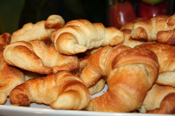 Croissants on a white plate, close-up, selective focus