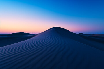 Fototapeta na wymiar Desert Dunes Under Twilight Sky