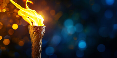 torch with Olympic flame on a dark background, copyspace