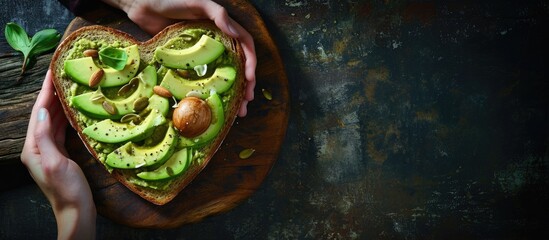 heart shaped healthy avocado toast for valentine day breakfast. Copy space image. Place for adding text - obrazy, fototapety, plakaty