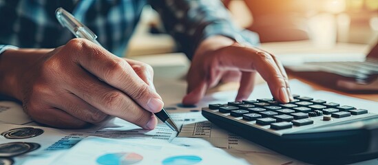 Mature smalll business owners calculating finance bills of their activity Business people using calculator to work Closeup hands of man and woman calculating bills and expenses. Copy space image - obrazy, fototapety, plakaty