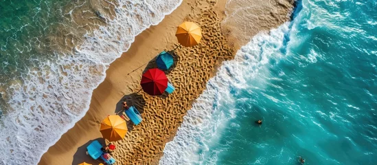 Gordijnen Tropical beach with colorful umbrellas Picture with drone. Copy space image. Place for adding text © Ilgun