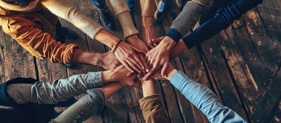 Foto op Canvas Multiethnic Ethnic Business people Putting Hand Volunteer Friendship Together Friends with stack of hands showing unity and trust worthy Partnership Teamwork team Collaborate working with compe © Ilgun