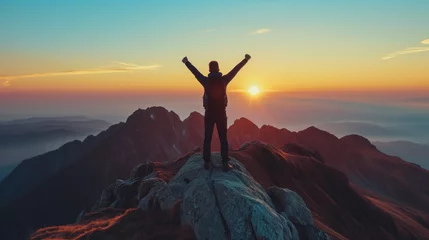 Tuinposter Strong and confident man standing on to a mountain. Fit active lifestyle concept. Positive man celebrating on mountain top, with arms raised up, Goal, successful, achievement  © Sweetrose official 