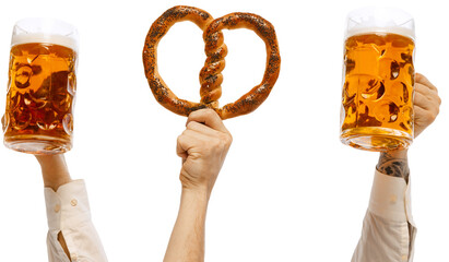 Hands holding hot delicious sausage on fork, pretzel and two mugs of cold lager light mugs of beer...