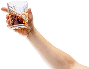 Cheers. One hand holds glass of whiskey or bourbon against transparent background. Concept of...