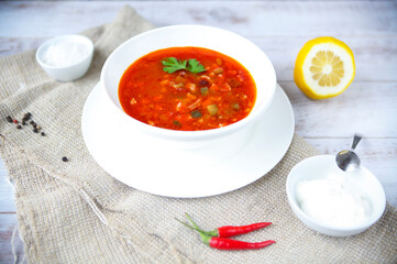 Red soup with sour cream and parsley