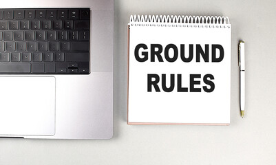 GROUND RULES text on notebook with laptop and pen