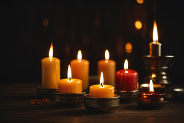 Fototapeta na wymiar burning candles in the dark background