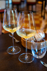 Tasting of Bordeaux white wine in Sauternes, left bank of Gironde Estuary, France. Glasses of white sweet French wine.