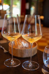 Tasting of Bordeaux white wine in Sauternes, left bank of Gironde Estuary, France. Glasses of white sweet French wine.
