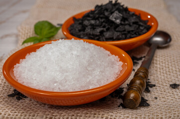 Black and white sea salt close up, Cyprus Black Salt shiny black pyramid-shaped crystals