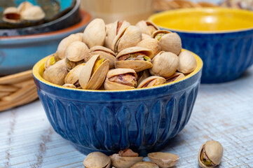 Roasted salty pistachio nuts, tasty healthy vegetarian snack food