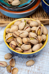 Roasted salty pistachio nuts, tasty healthy vegetarian snack food