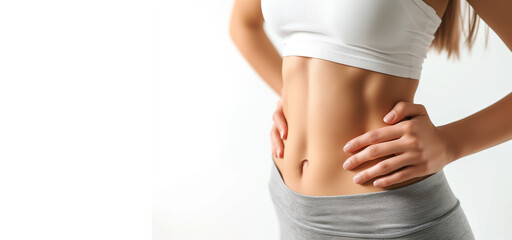 Fototapeta premium Young woman with flat belly white background, closeup. Plastic surgery concept. healthy lifestyle 