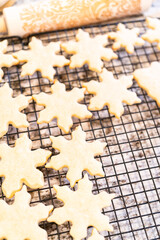 Cooling Snowflake-Shaped Sugar Cookies on a Rack