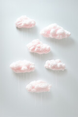 Light pink rainy clouds on light gray background.Minimal concept.