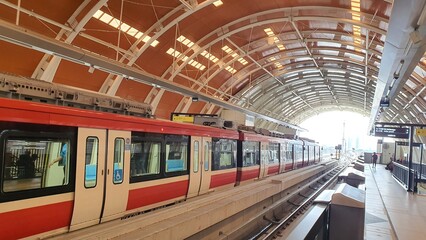 Jakarta, Indonesia – January 13, 2024: View of LRT Station Jakarta Dukuh Atas tunnel construction arch steel and railway from platform. - obrazy, fototapety, plakaty