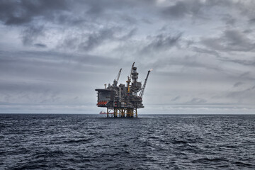 Panoramic view of offshore oil and gas oil filed in the sea with jackup drilling rig on the horizon...