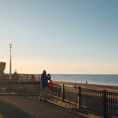 person walking on the beach