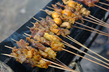 Sate Ambal is a chicken satay typical of the Kebumen area of Central Java. This satay is made from chicken meat seasoned with spices. Sate is cooked by grilling on a charcoal grill. Indonesian food.