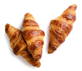 Three croissants close-up on a white. Top view