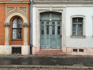 Fototapeta na wymiar Colourful ancient houses on cobble street in Budapest, Hungary