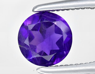 natural purple amethyst quartz gem on the background