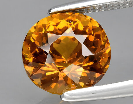 natural yellow grossular garnet gem on the background