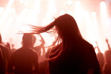 Person, dancing and crowd or concert silhouette for live music performance or festival, rock or...