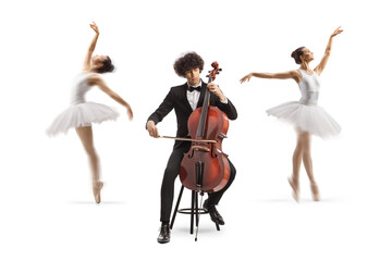 Male cellist sitting on a chair and performing and ballerinas dancing in the back