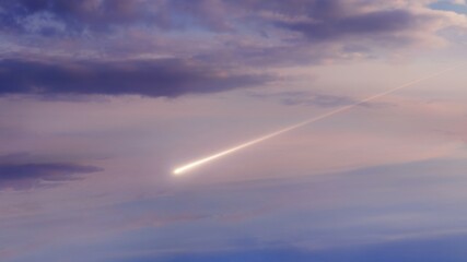 Meteor in the sky in the light of the sun. A meteorite falls in the daytime. Bright fireball at...